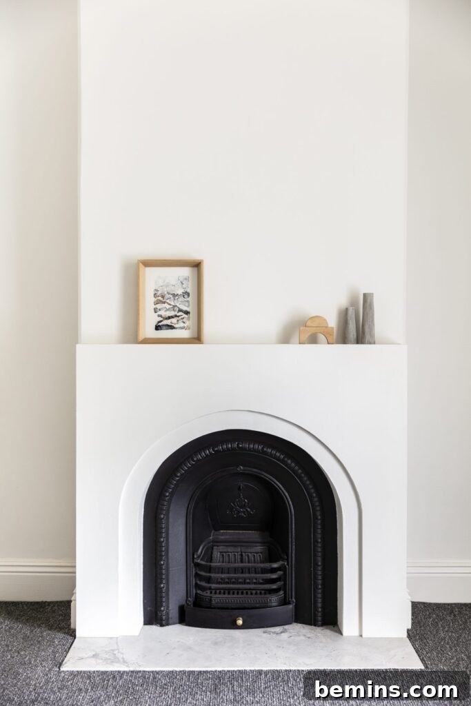 Classic fireplace hearth with a modern plaster surround.
