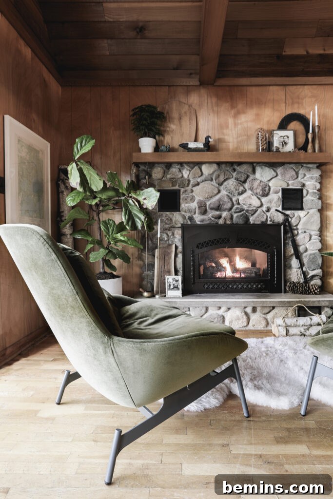 Traditional stone fireplace in a modern cabin.
