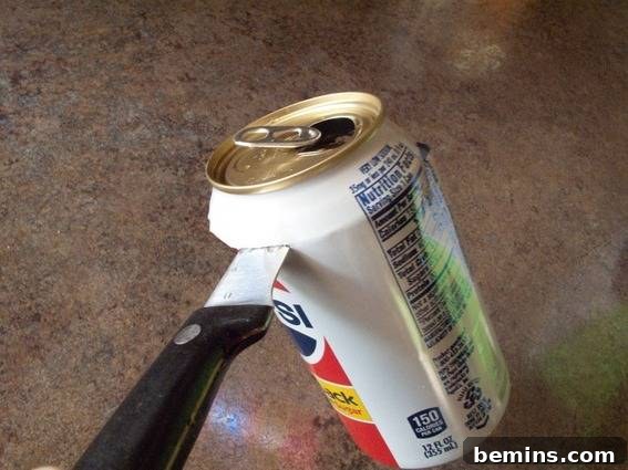 Cutting the soda can for flower lights