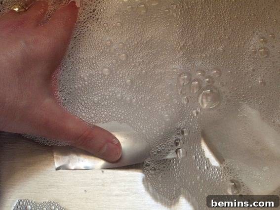 Washing aluminum sheets