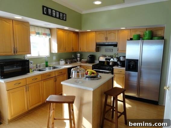 Before: Kara's kitchen with dated yellow oak cabinets