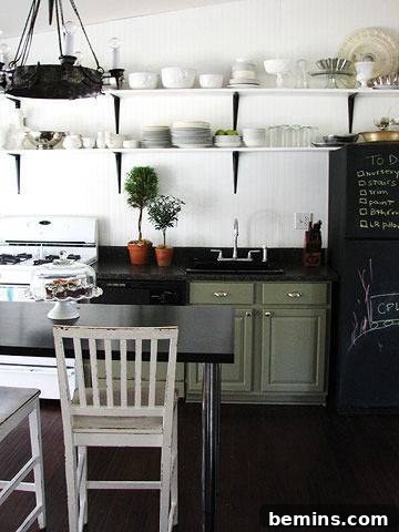 After: Lauren's bright and airy kitchen with open shelving and sage green cabinets