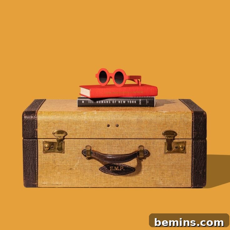 Repurposed suitcase used for under bed shoe storage