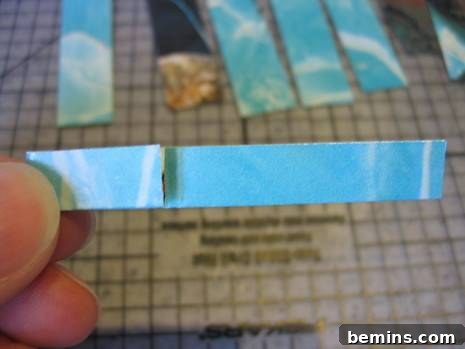 Crafting Connections: A Guide to Paper Chain Creations 7 Close-up of a folded paper strip, ready to be linked into the chain.