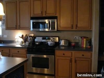 5 Quick and Budget-Friendly Cabinet Refresh Ideas 4 A kitchen with wood cabinets after glazing, showcasing the added depth and new hardware.