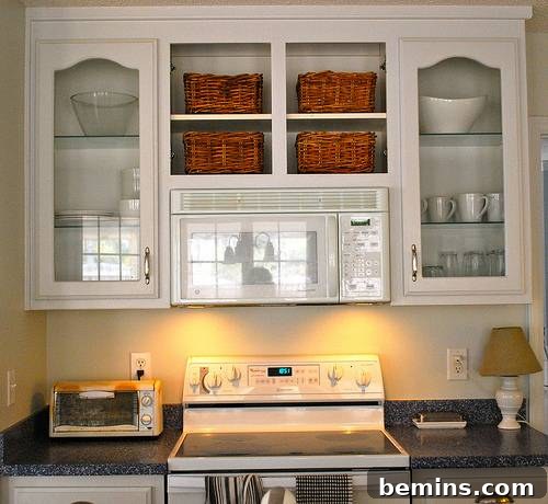 5 Quick and Budget-Friendly Cabinet Refresh Ideas 6 Kitchen cabinets after removing doors, creating an open and breezy feel.