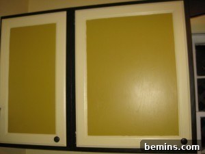 5 Quick and Budget-Friendly Cabinet Refresh Ideas 9 Cabinets painted in white, black, and yellow before the wrapping paper makeover.