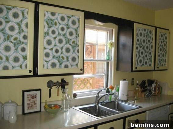 5 Quick and Budget-Friendly Cabinet Refresh Ideas 10 Kitchen cabinets covered in floral wrapping paper, adding a charming and whimsical touch.