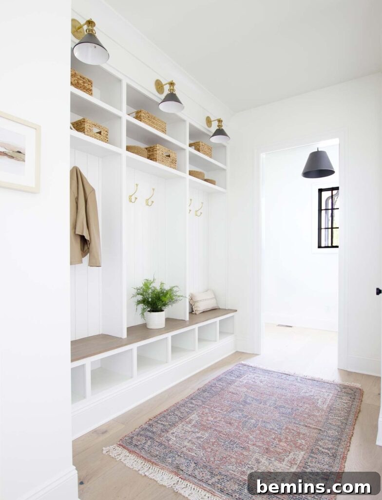 Clean white mudroom with cubbies