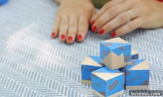Creating a Contemporary Geometric Mobile: A DIY Guide 3 Taping Wooden Cubes