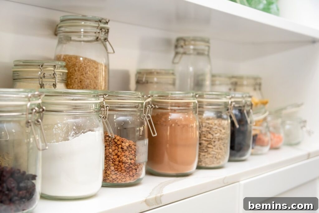 Well-organized pantry with jars filled with various foods