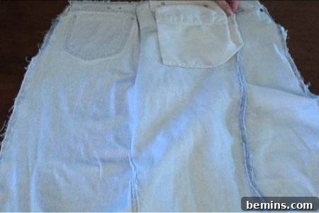How to Sew Your Own Overalls 11 Person sewing pockets to a cloth.