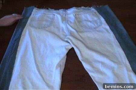 How to Sew Your Own Overalls 22 Light colored blue jeans are on top of dark ones.