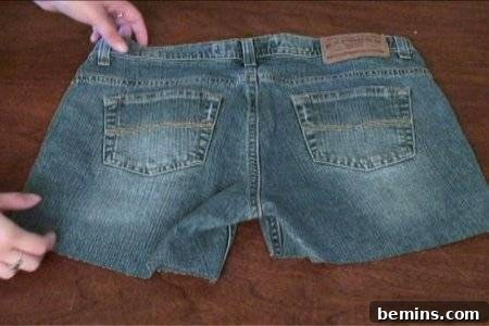How to Sew Your Own Overalls 26 A the backside of a pair of jeans that has been cut into shorts.