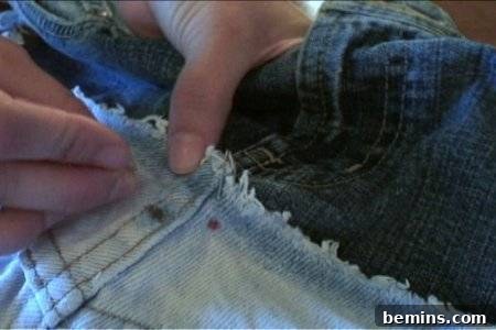 How to Sew Your Own Overalls 33 "Blue and white combination of jeans with sewing materials."