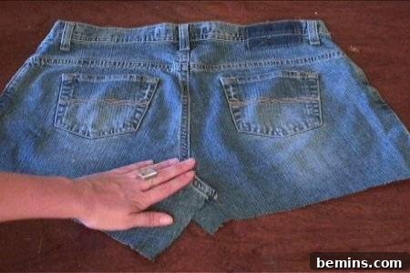 How to Sew Your Own Overalls 40 A person holding a jeans pant.