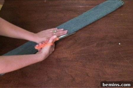 How to Sew Your Own Overalls 49 "A lady is cutting a material to make overalls"