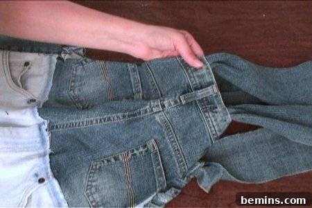 How to Sew Your Own Overalls 52 Two pairs of blue jeans hemmed together to make overalls.
