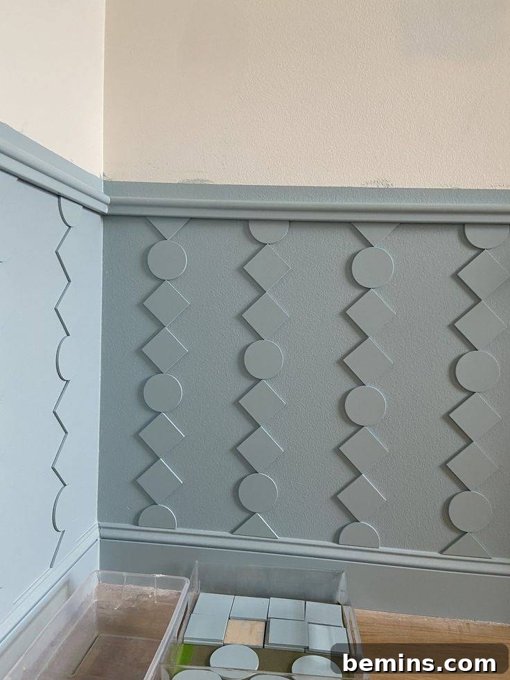 Charming Wainscoting: 21 Ways to Elevate Your Home 14 Green geometric wainscoting on lower panel of walls