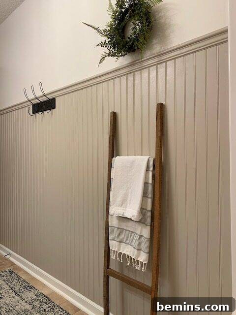 Charming Wainscoting: 21 Ways to Elevate Your Home 3 Beadboard wall with decorative ladder.