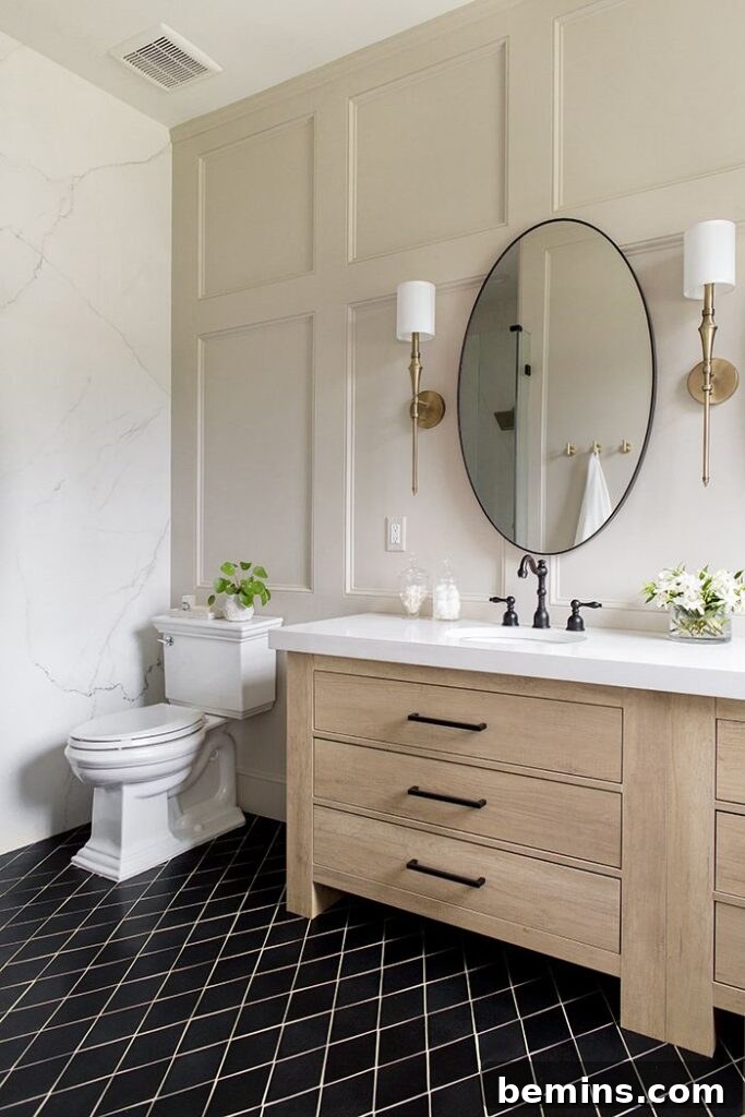 Charming Wainscoting: 21 Ways to Elevate Your Home 8 Recessed panel wainscoting white in bathroom with beige counter and circle mirror