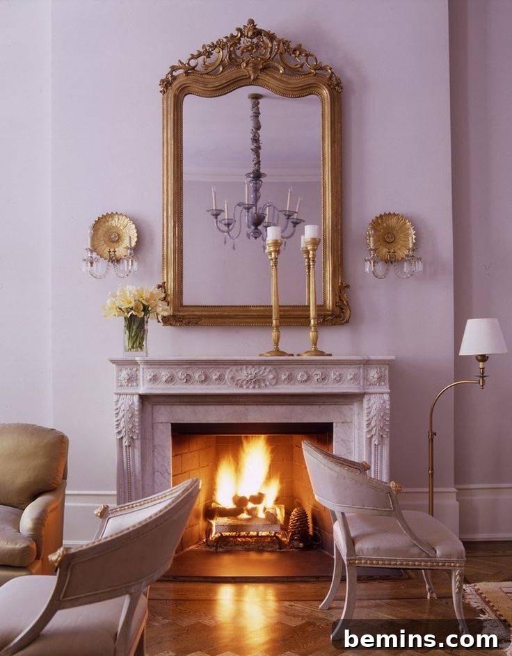 Lavender fireplace with two lavender chairs and gold mirror