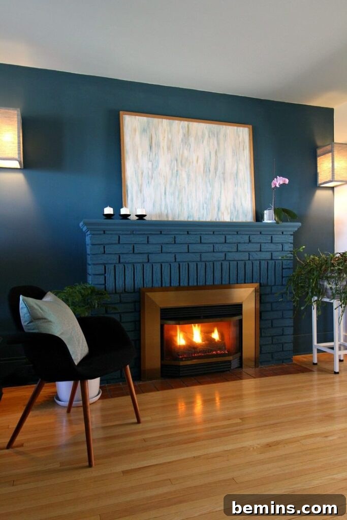 Coastal blue painted brick fireplace in living room with chair