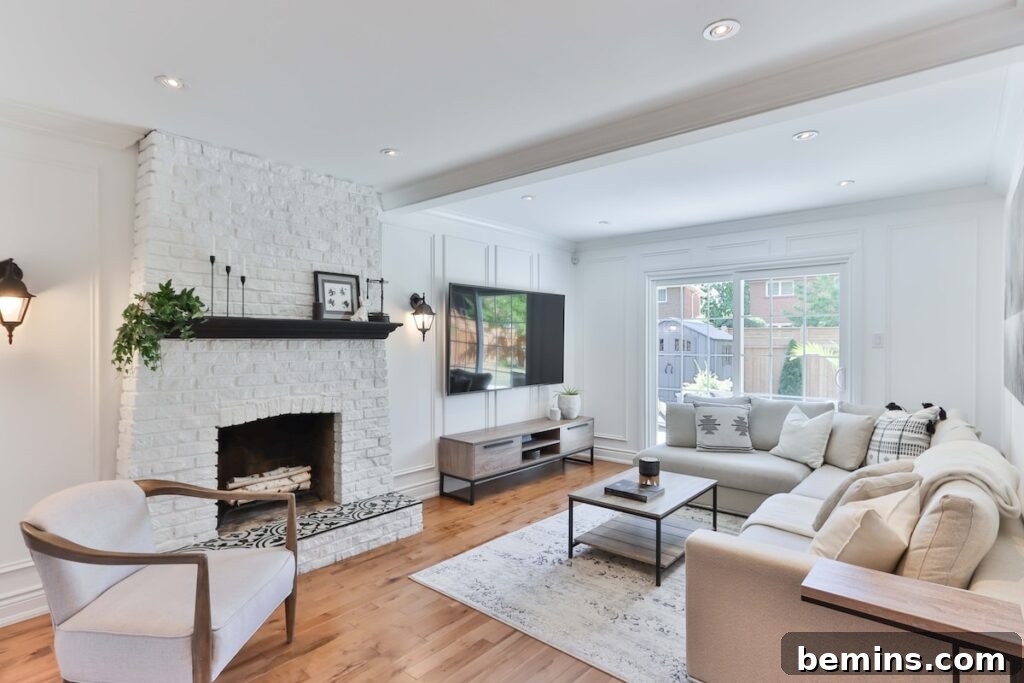 Living room with white sofa and black flat screen tv