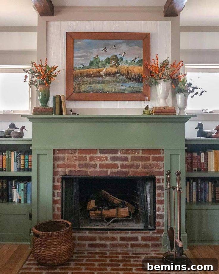 Green and red brick craftsman fireplace with a painting on the wall in living room space