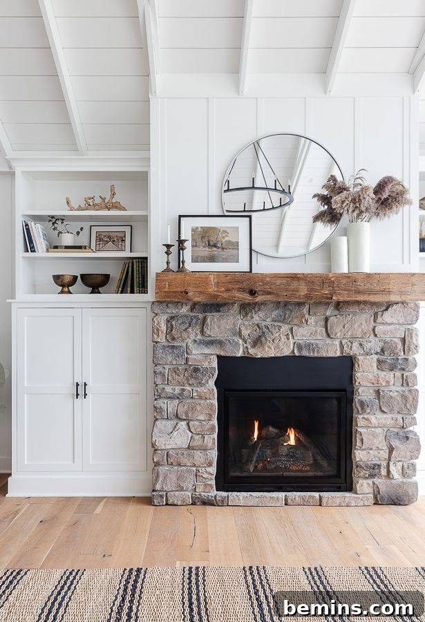 Large brown brick fireplace with mirror and decorative flowers