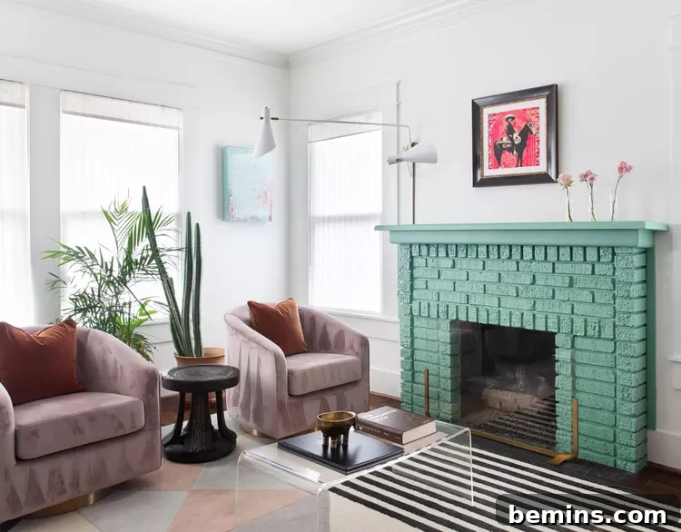 Painted brick fireplace in living room with two lounge chairs