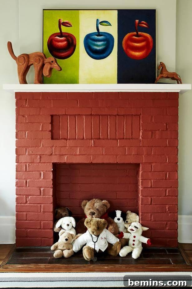 Red fireplace with stuffed animals sitting in front