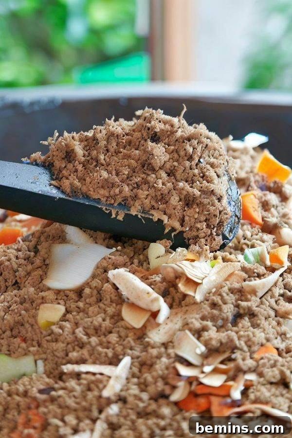 Bokashi compost with wooden spoon