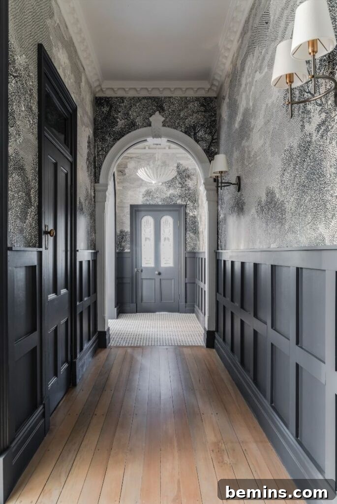 Black wainscoting along entryway of home 
