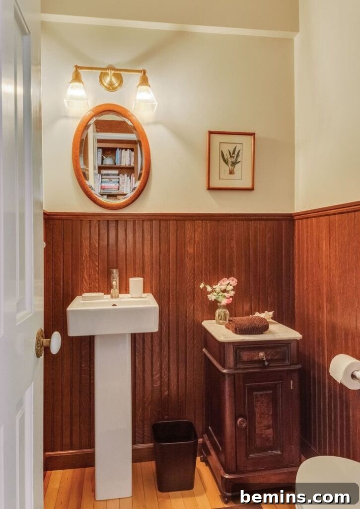 Victorian bathroom with wood paneling wainscoting