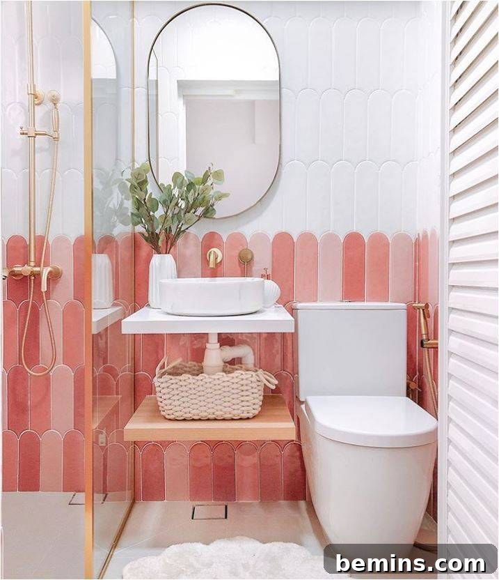 Pink and white wainscoting in bathroom with toilet and sink
