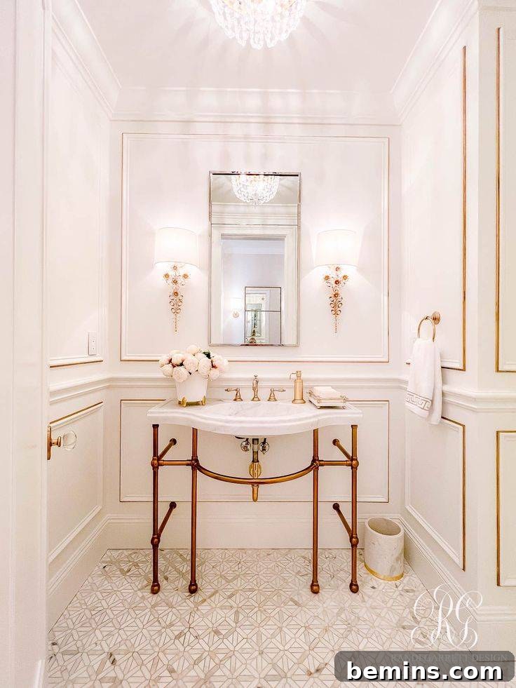 Bathroom with gold and white sink and white wainscoting with gold trim