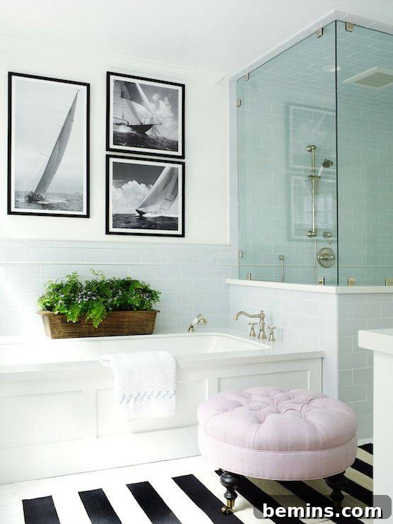 Glass shower door in white bathroom