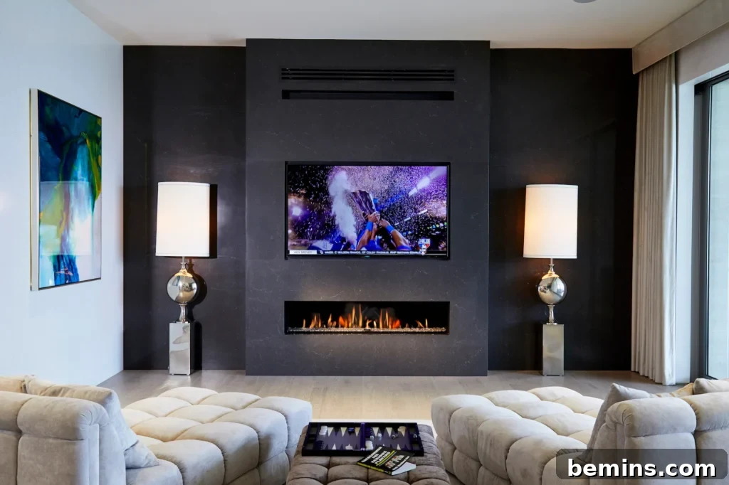Black wall in living room with fireplace and tv