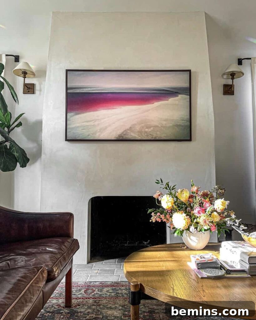 Stucco fireplace with colorful abstract painting in a contemporary living room