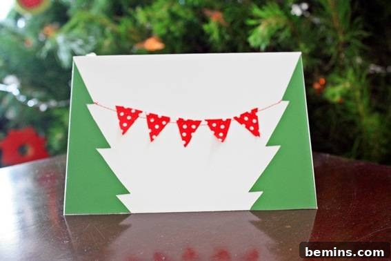 A green and white colored envelope resting on a wooden surface, ready to mail a handmade card.