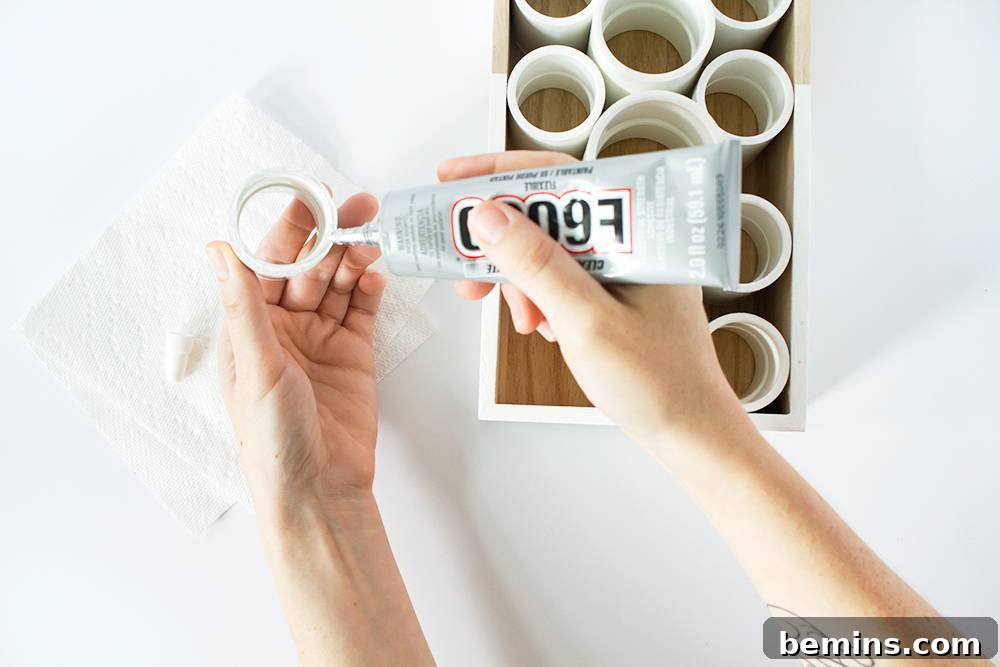 Creating a Purr-fect Puzzle Feeder: A Simple DIY Project for Your Cat 5 Applying glue to PVC pipe - Securing the puzzle's components