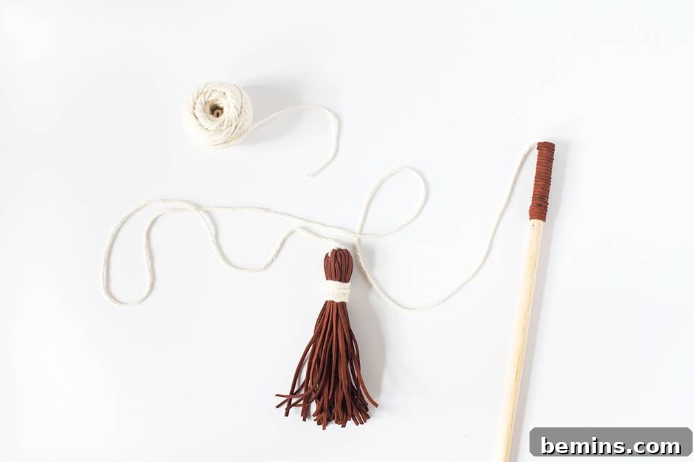 A finished DIY cat wand toy, ready for playtime.