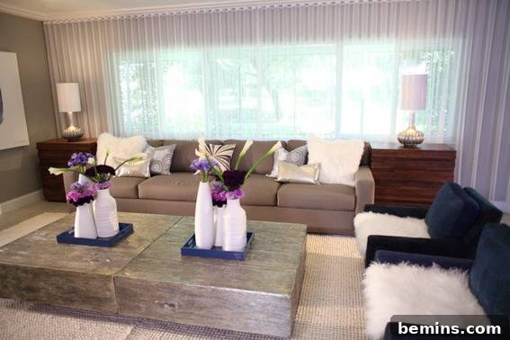 David Bromstad's Guide: Neutral Colors That Spark Joy 6 Living room featuring white vases, brown couch, and blue chairs showcasing a smoky neutral palette