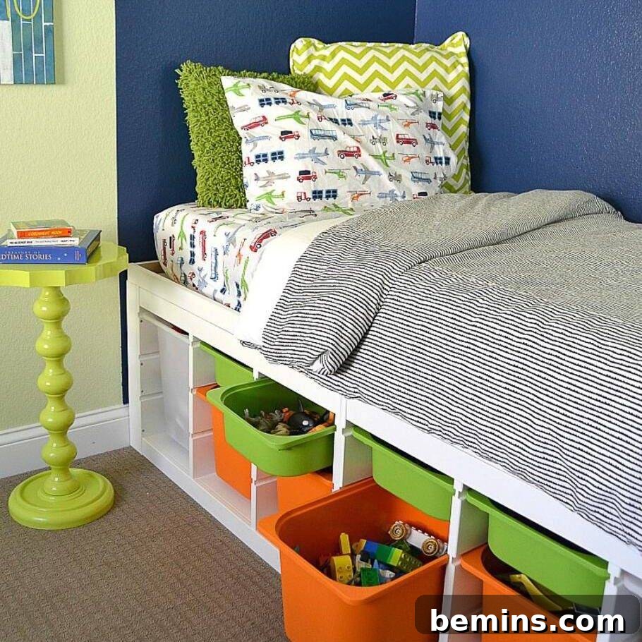 Childs bed with Trofast unit underneath. Twin sized bed with grey blanket and blue walls.