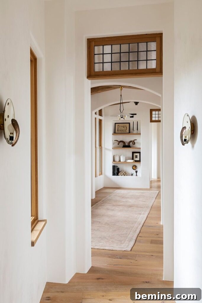 Transom Windows: A Complete Guide 4 White entryway with transom window outlined by brown wood