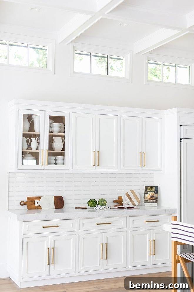 Transom Windows: A Complete Guide 5 White kitchen with three transom windows at the top near the ceiling