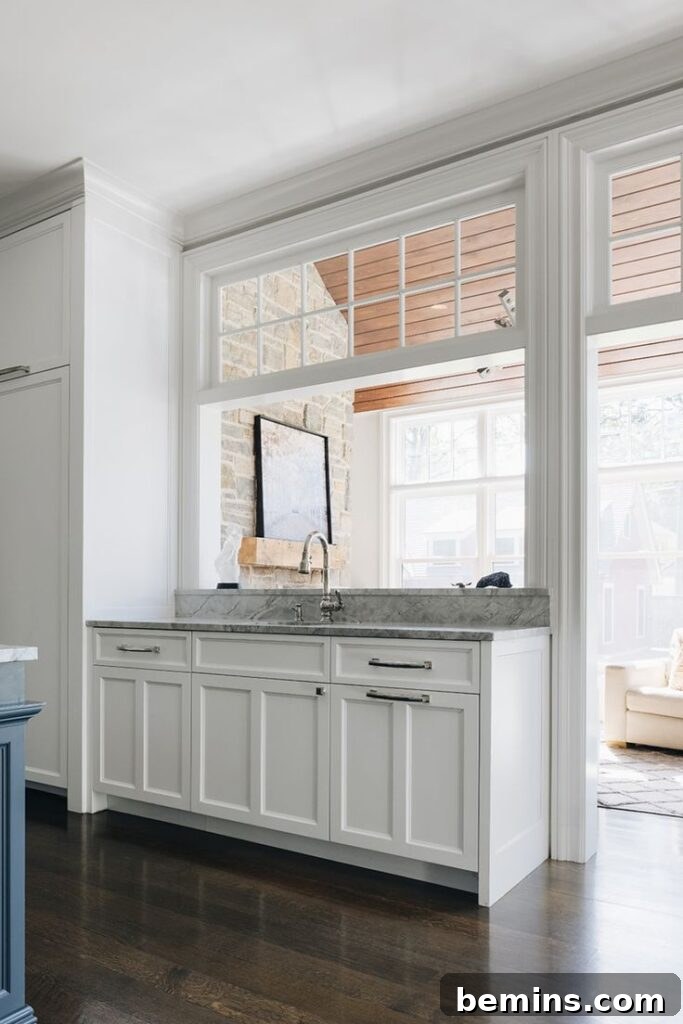 Transom Windows: A Complete Guide 7 Entryway to sunroom with white transom windows and grey counter below