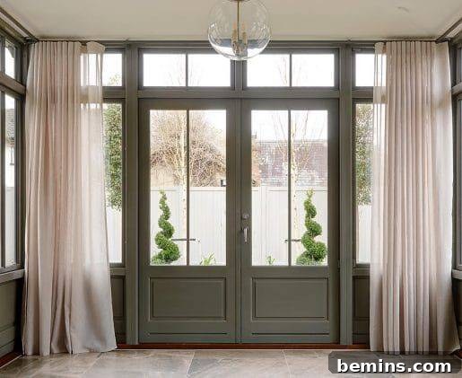 Transom Windows: A Complete Guide 9 Doorway with green painted doors and transom windows