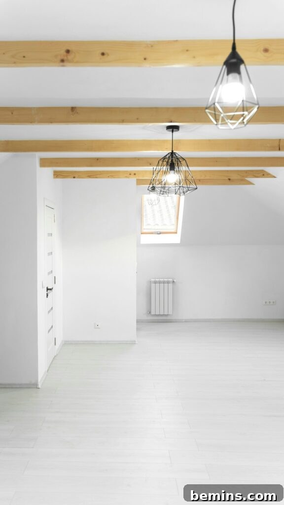 Clean attic space with a ceiling fan